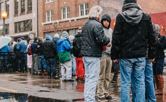 Customers wait in a long line