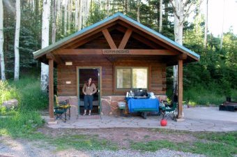 Morning sunlight shines on a cabin at Sylvan Lake State Park near Eagle, CO